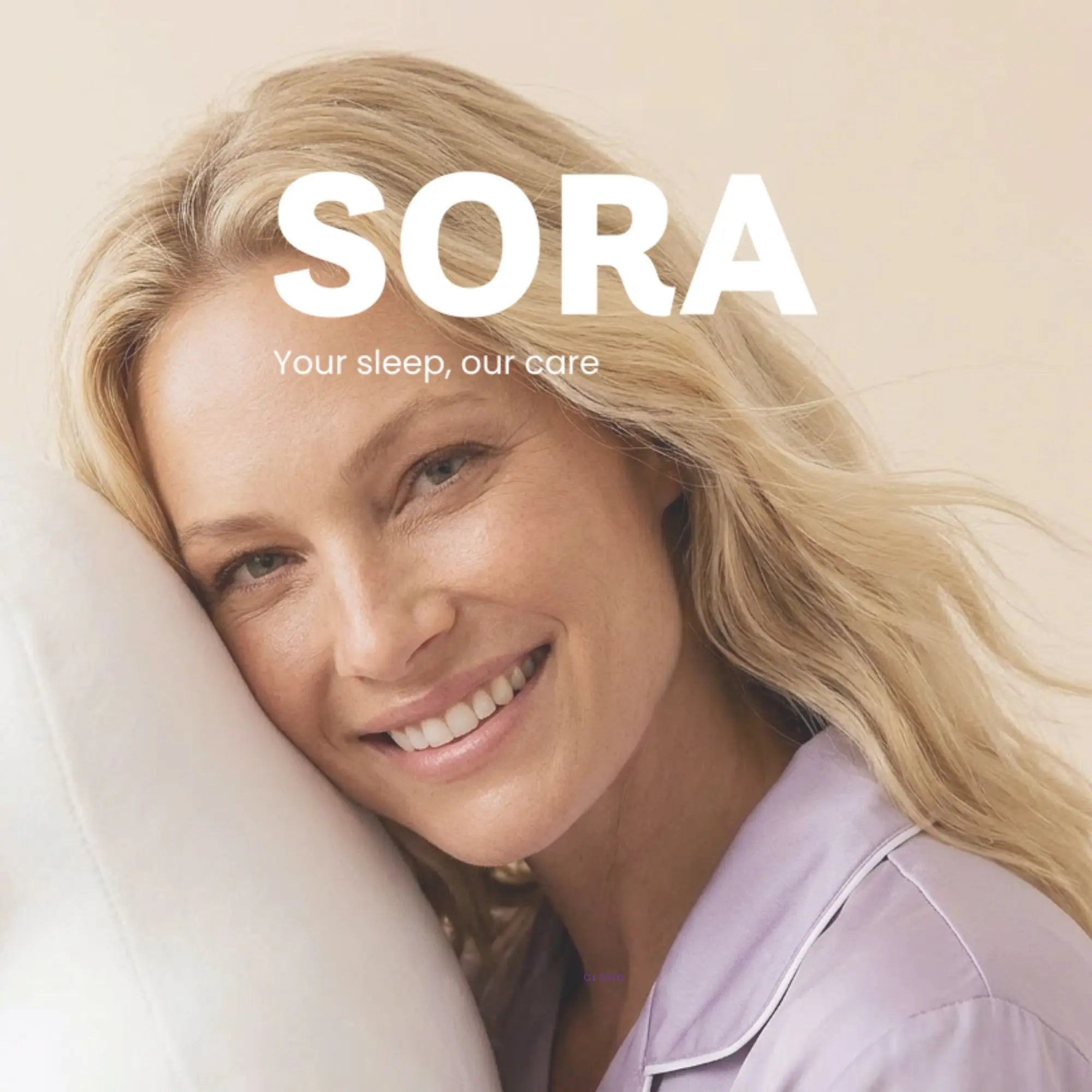 Woman resting on SORA ergonomic pillow smiling — wake up rested with SORA Cares sleep wellness brand