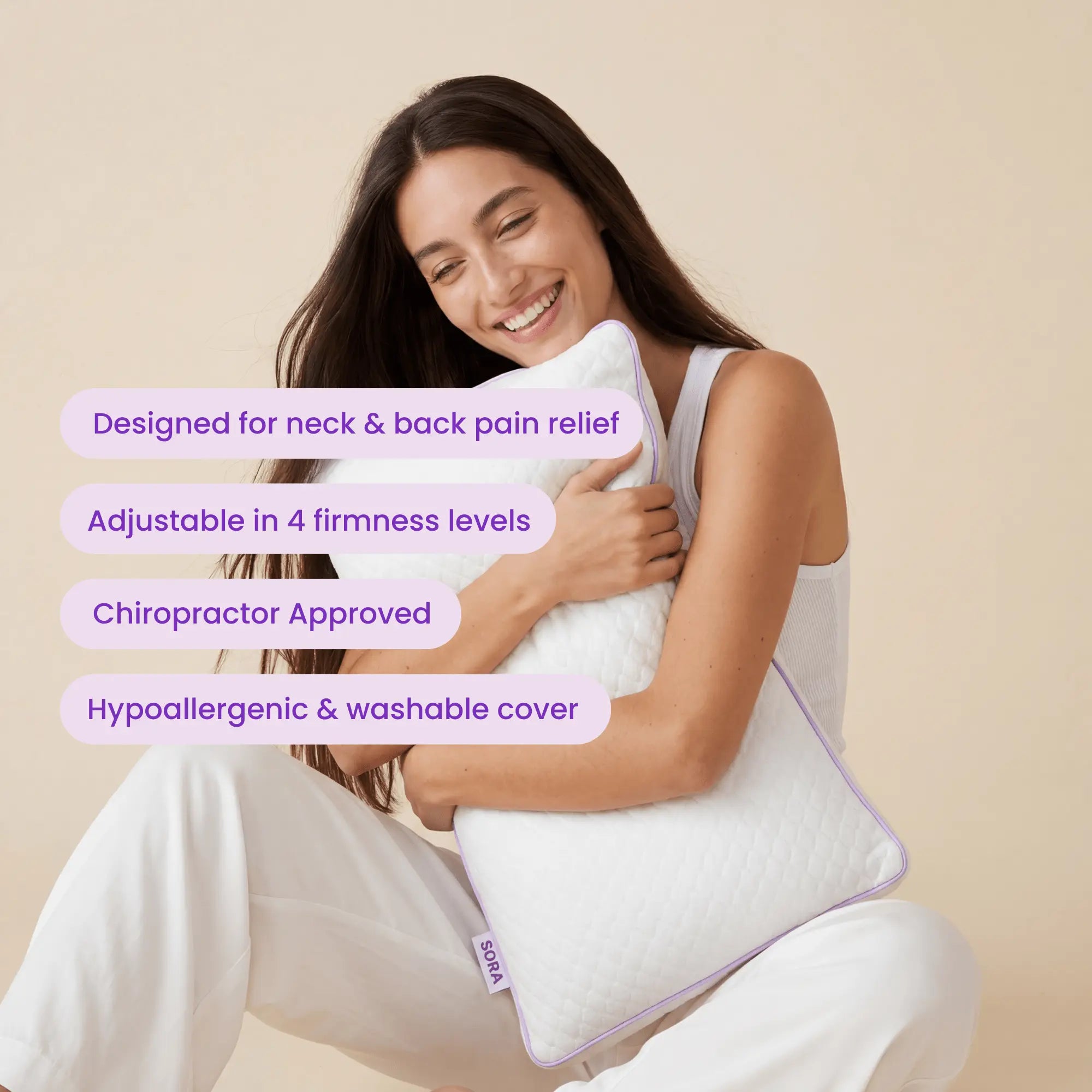 Woman hugging SORA Adjust pillow showing key features: neck pain relief, 4 firmness levels, chiropractor approved, hypoallergenic cover
